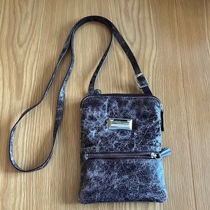 Latino, distressed leather eggplant color crossbody with secret coin slot!